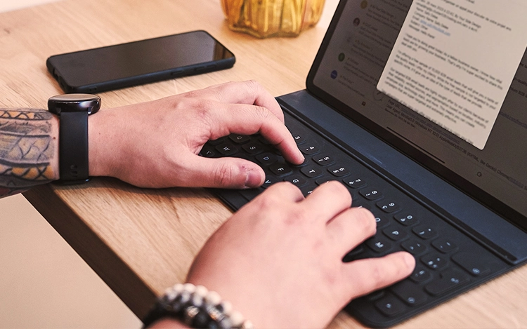 Close up on hands typing